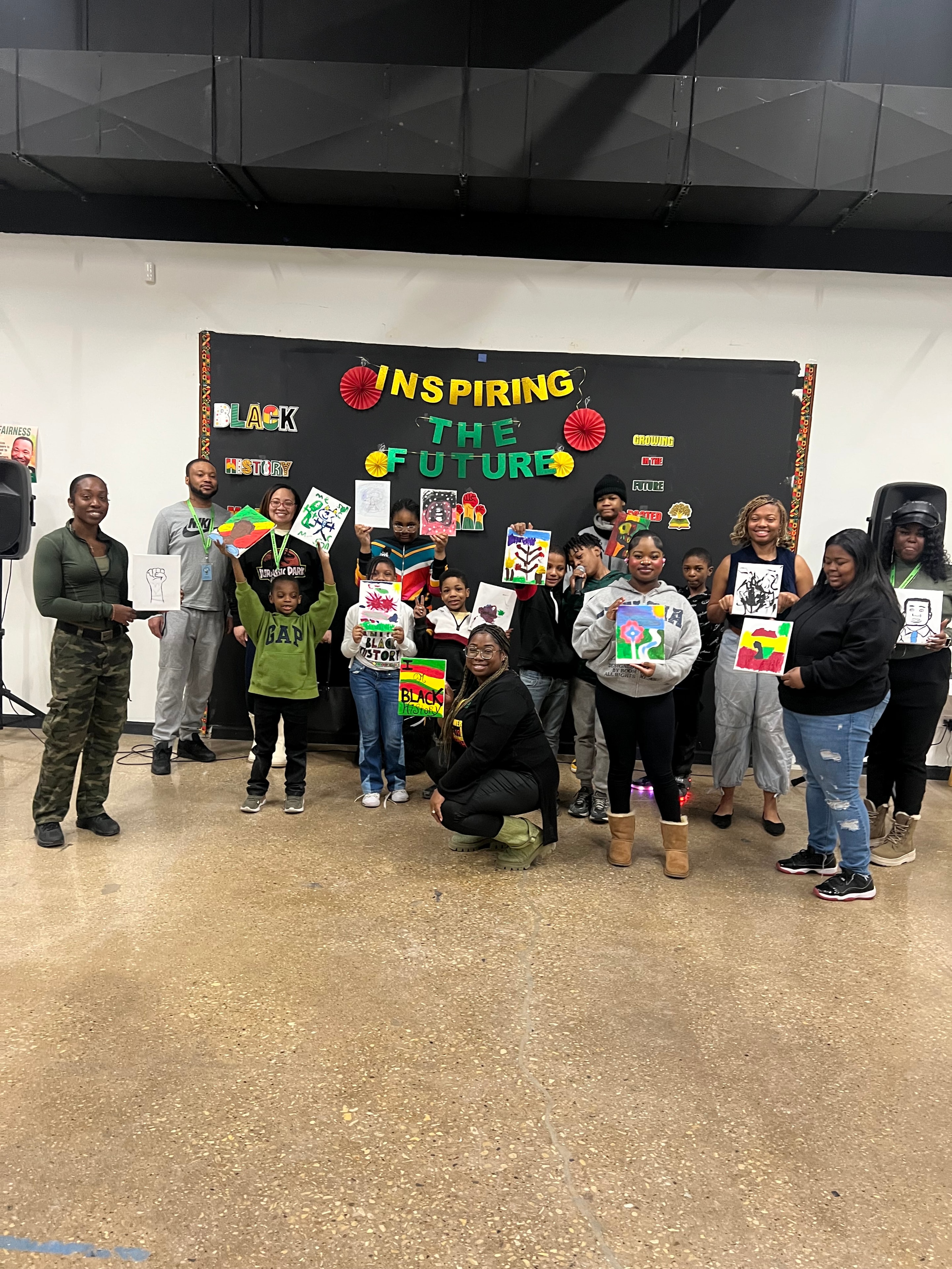 Youth holding artwork at Inspiring the Future event