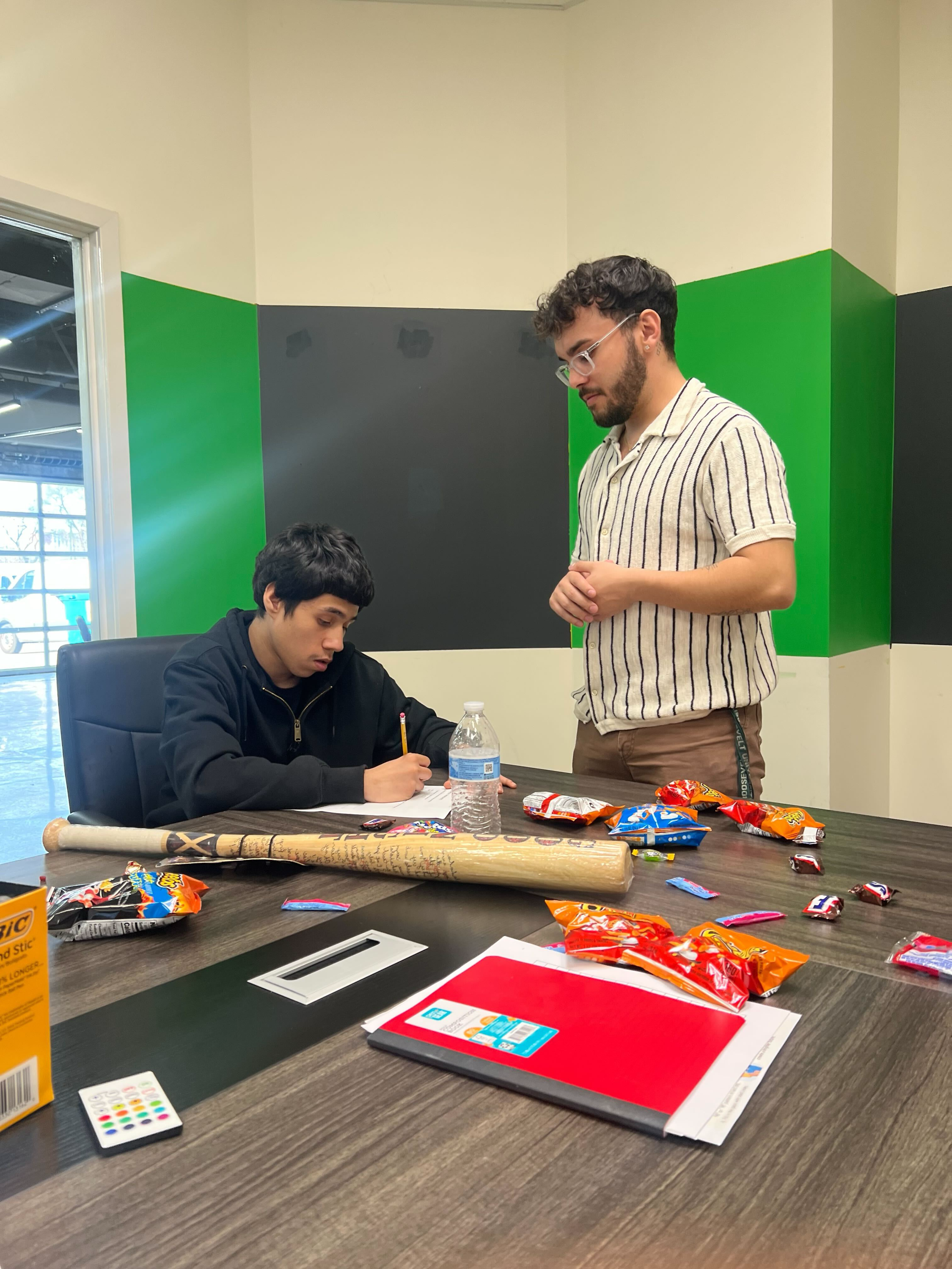 Two men working on a creative project together