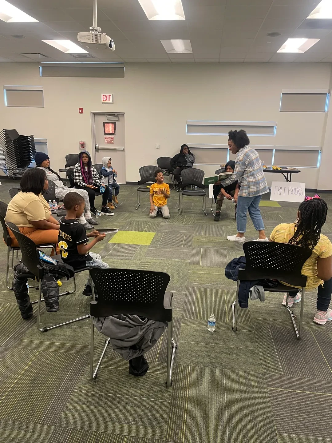 Children gathered in a circle at a community reading program